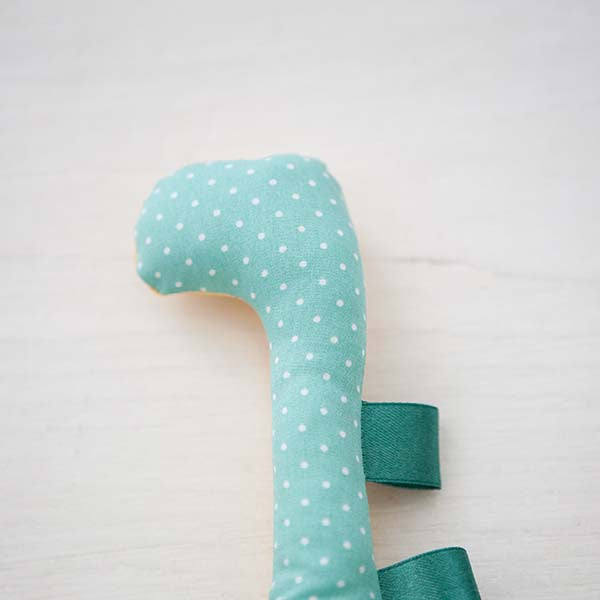 Dinosaurier Rassel mint & gelb