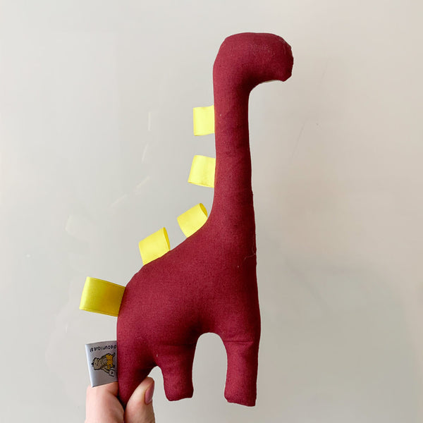 Dinosaurier Rassel beige & Dreiecke bordeaux